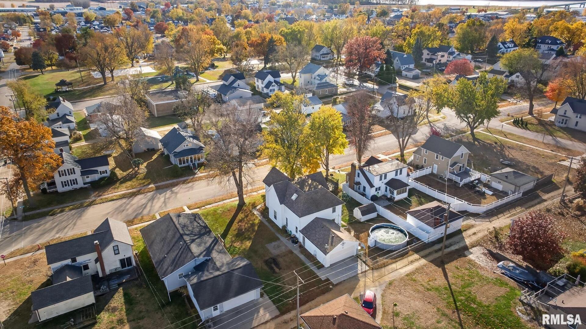 919 9th Avenue Fulton, IL 61252 - Photo 12 of 54 an aerial view of a swimming pool with outdoor seating