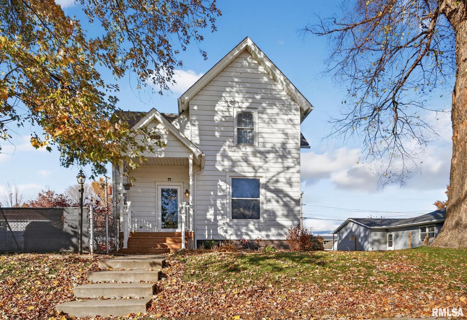 919 9th Avenue Fulton, IL 61252 - Photo 15 of 54 a front view of a house with a yard