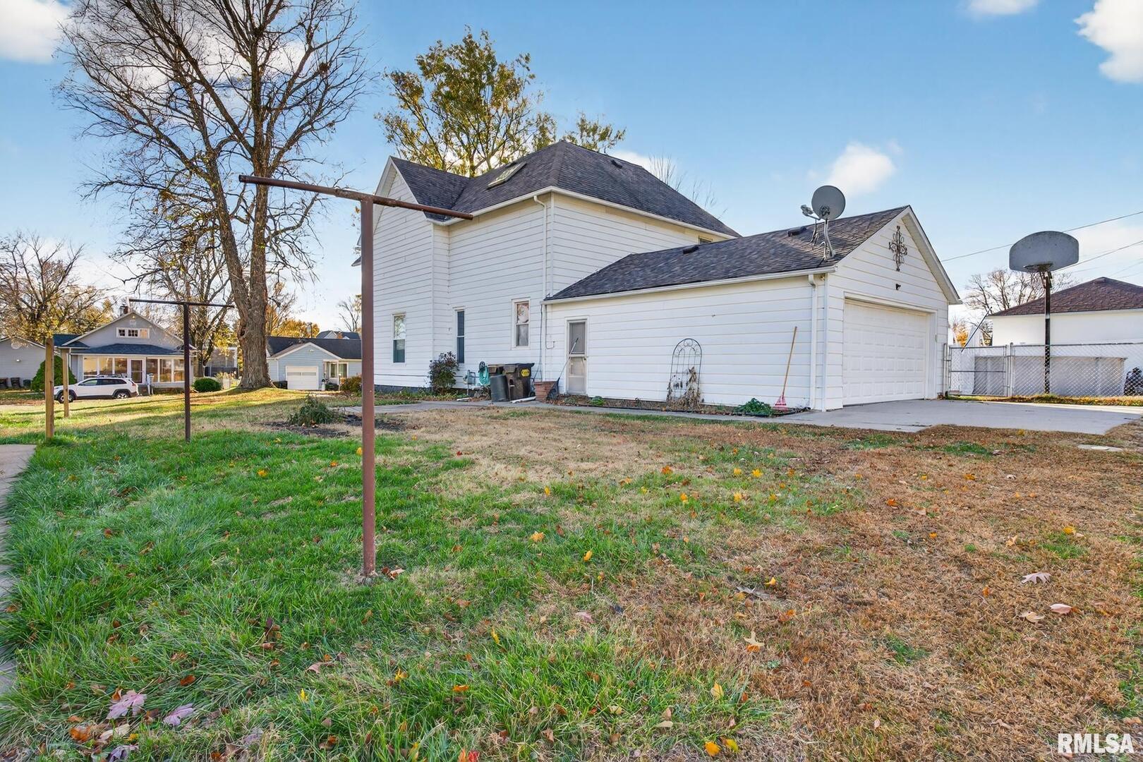 919 9th Avenue Fulton, IL 61252 - Photo 17 of 54 a view of a house with backyard and trees