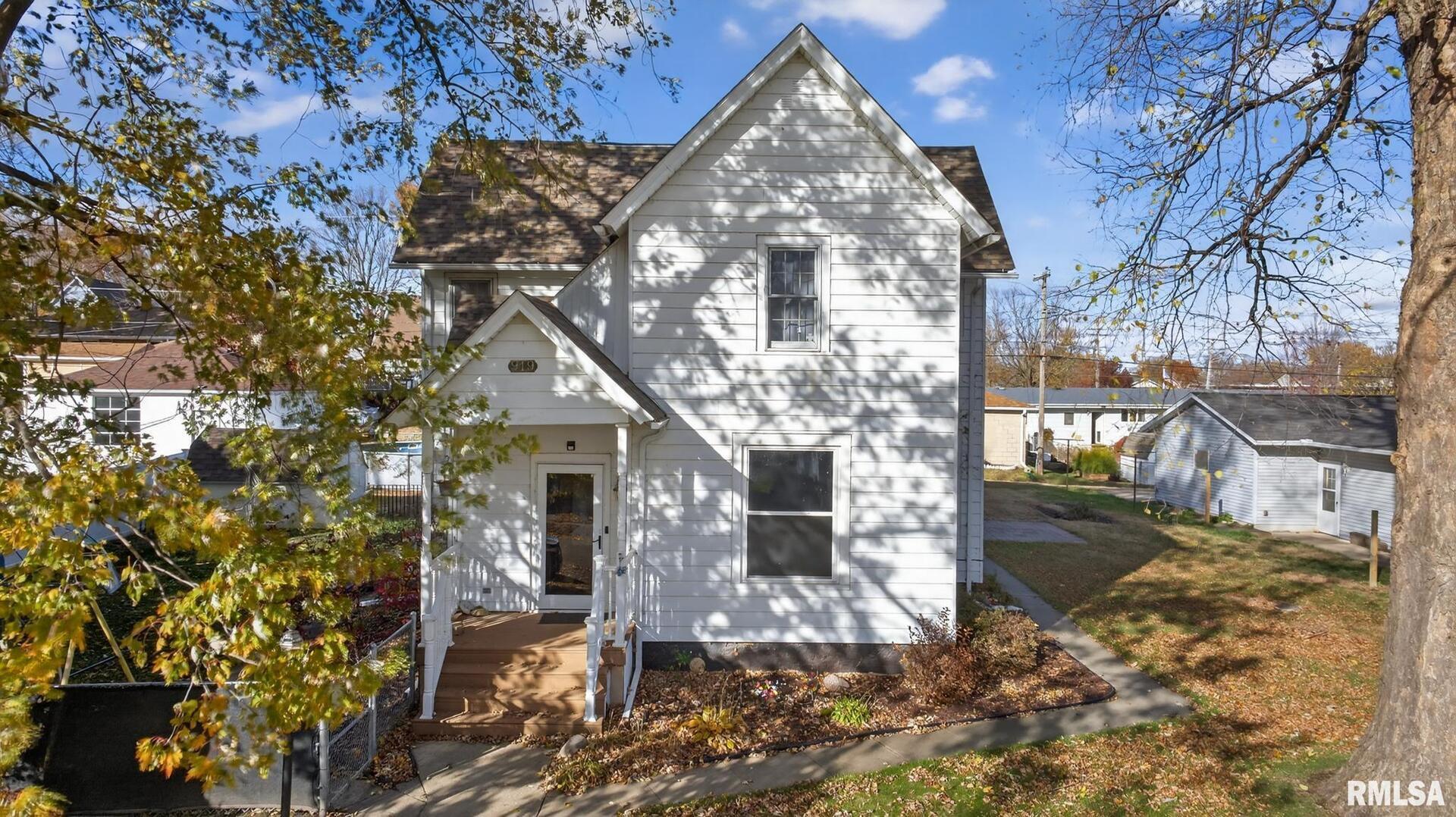919 9th Avenue Fulton, IL 61252 - Photo 2 of 54 a front view of a house with yard porch and livingroom
