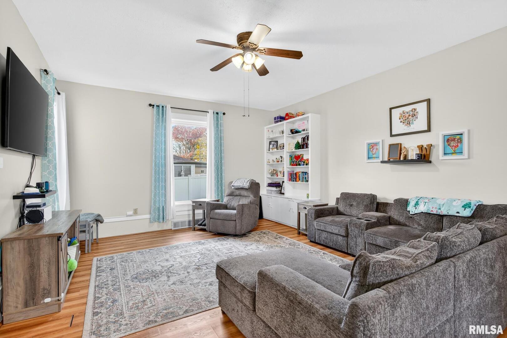 919 9th Avenue Fulton, IL 61252 - Photo 26 of 54 a living room with furniture and a flat screen tv