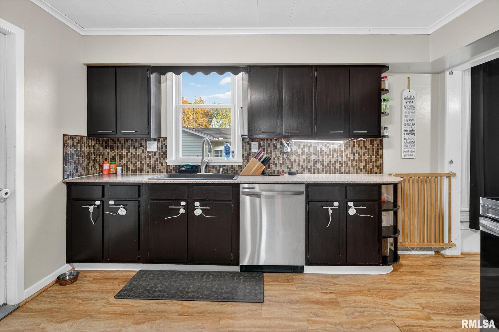 919 9th Avenue Fulton, IL 61252 - Photo 30 of 54 a spacious bathroom with a granite countertop sink and a mirror