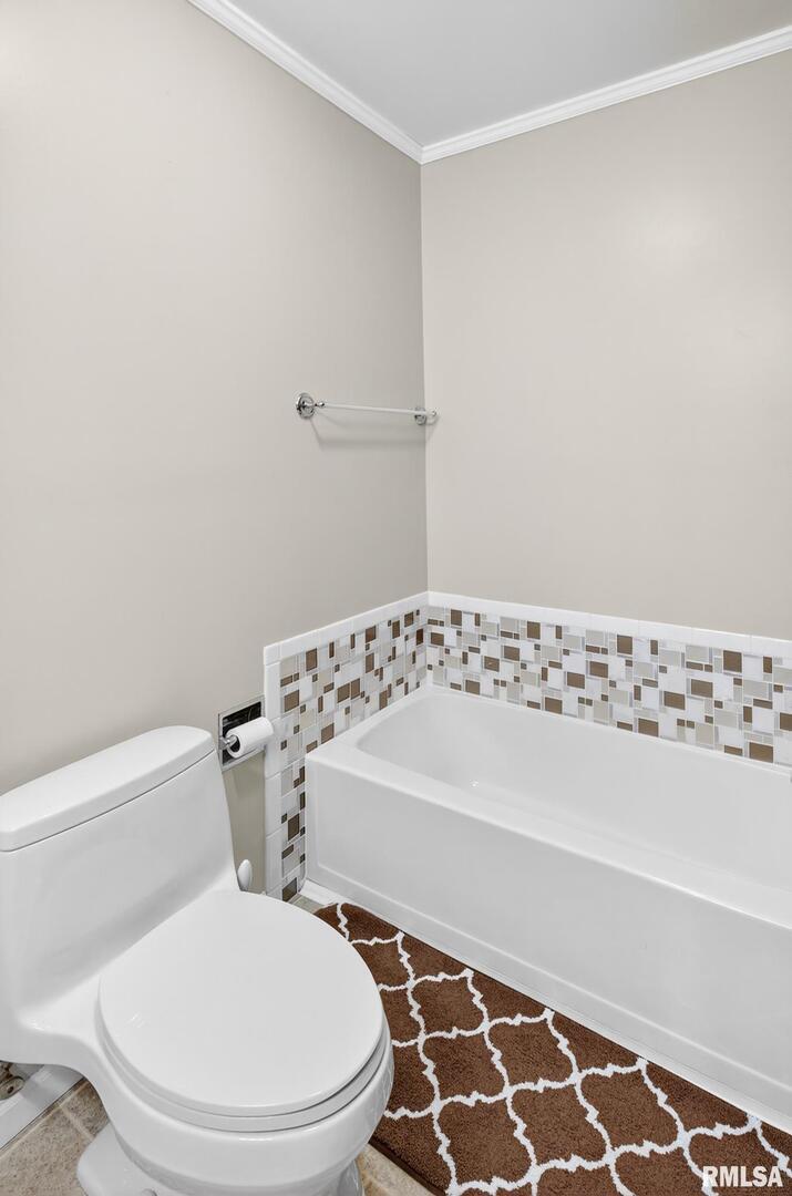 919 9th Avenue Fulton, IL 61252 - Photo 46 of 54 a white toilet sitting next to a bathroom sink