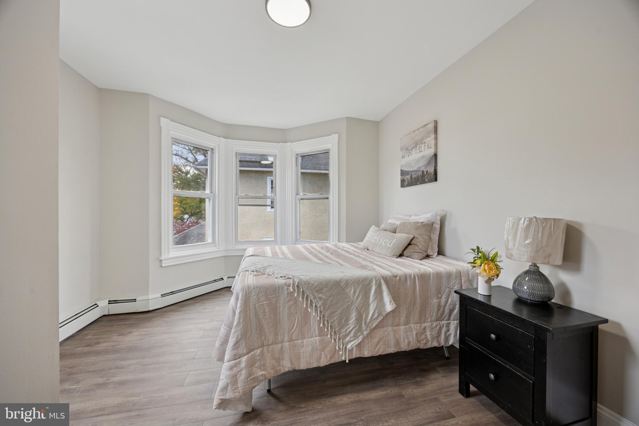 405 North Swarthmore Avenue Ridley Park, PA 19078 - Photo 14 of 35 a bedroom with a bed and window