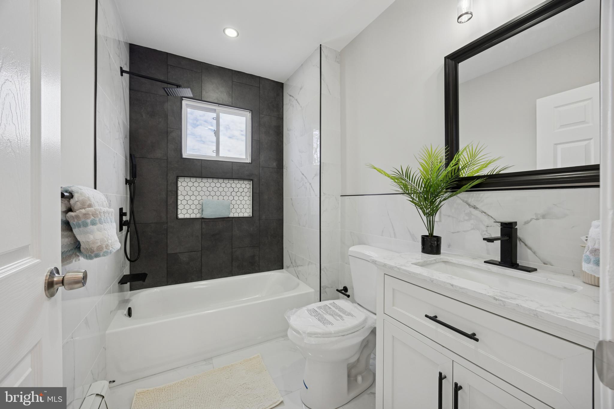 405 North Swarthmore Avenue Ridley Park, PA 19078 - Photo 16 of 35 a bathroom with a sink a toilet and a bathtub