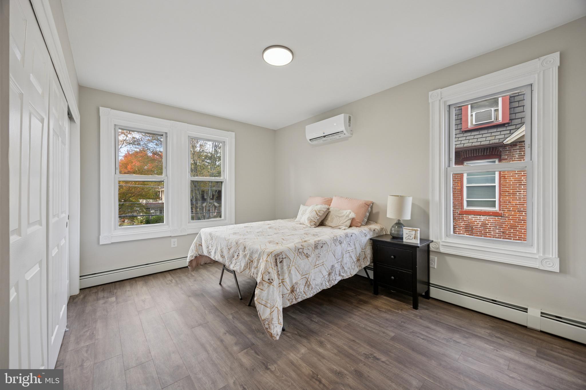 405 North Swarthmore Avenue Ridley Park, PA 19078 - Photo 18 of 35 a spacious bedroom with a large bed and a window