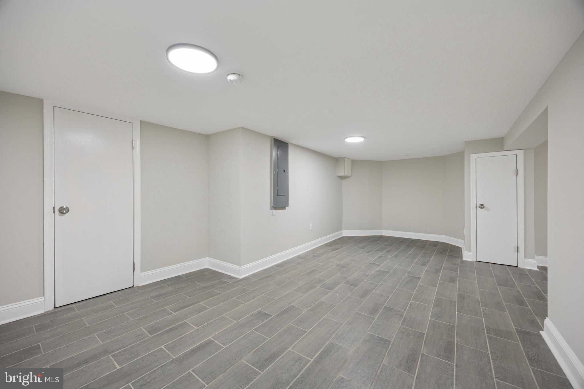 405 North Swarthmore Avenue Ridley Park, PA 19078 - Photo 30 of 35 a view of an empty room with wooden floor