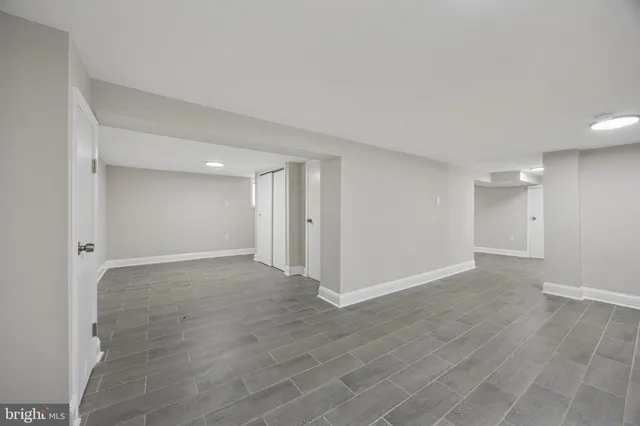 a white toilet sitting next to a bathroom sink