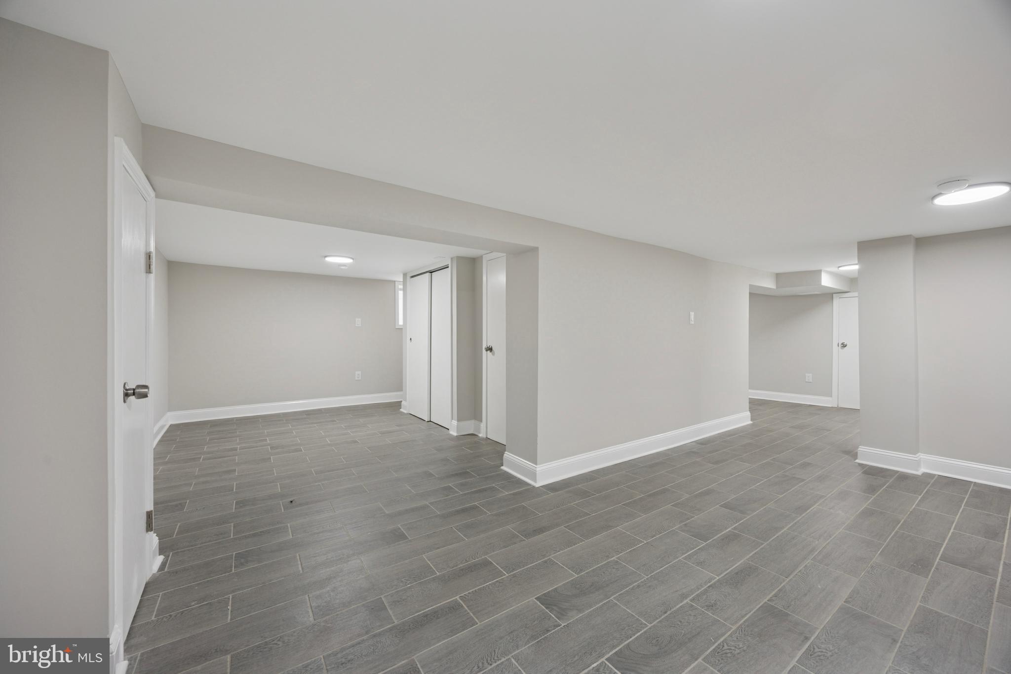 405 North Swarthmore Avenue Ridley Park, PA 19078 - Photo 31 of 35 a view of an empty room with wooden floor