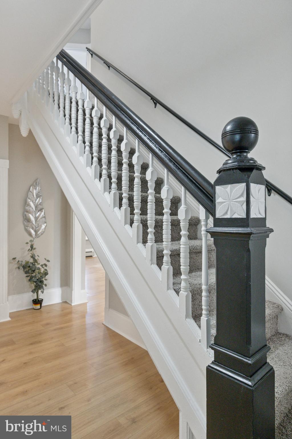 405 North Swarthmore Avenue Ridley Park, PA 19078 - Photo 4 of 35 a view of staircase with lots of frames on wall and a chandelier