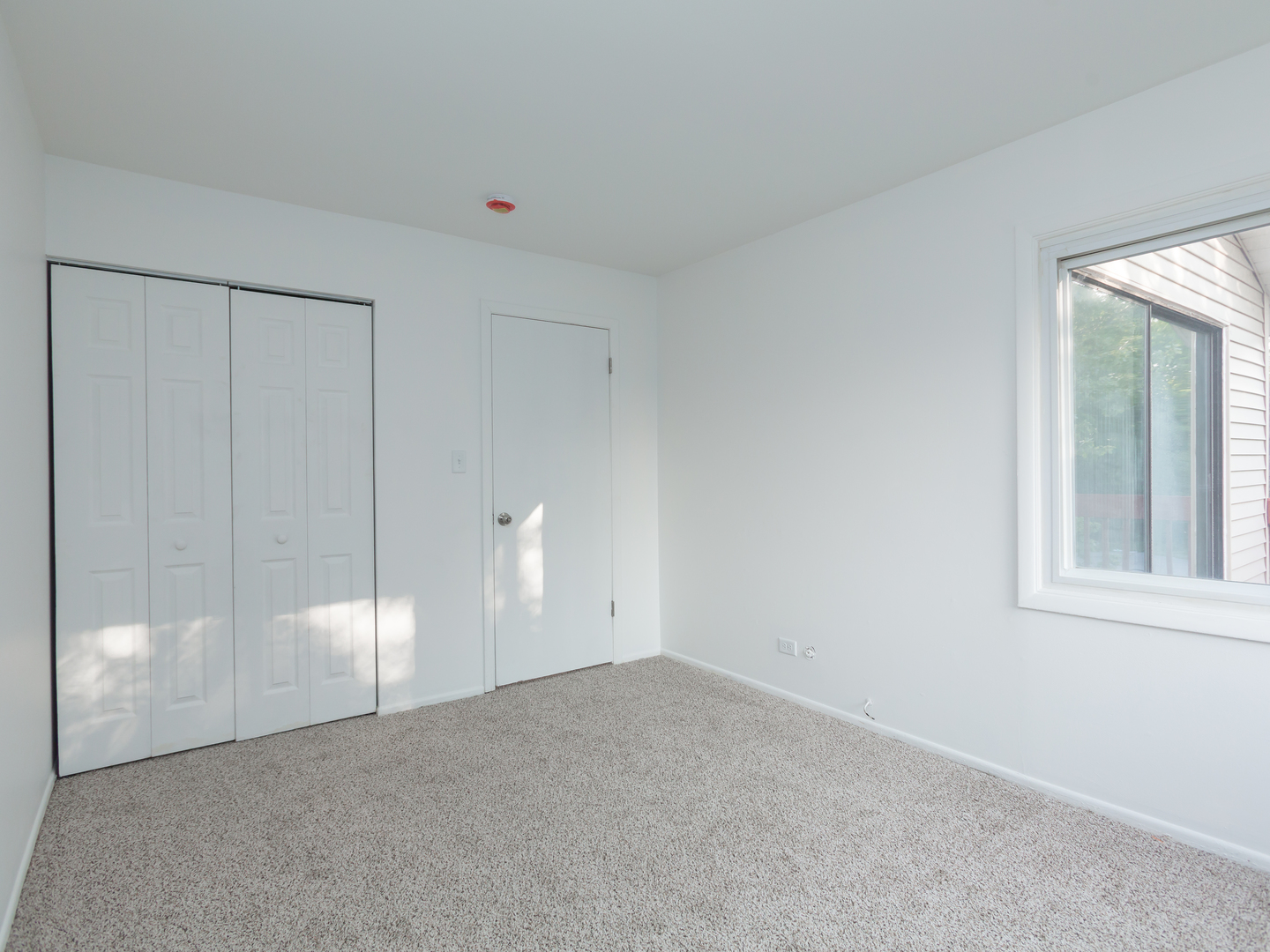 701 Spring Court, Unit 5 University Park, IL 60484 - Photo 11 of 17 a view of an empty room with a window