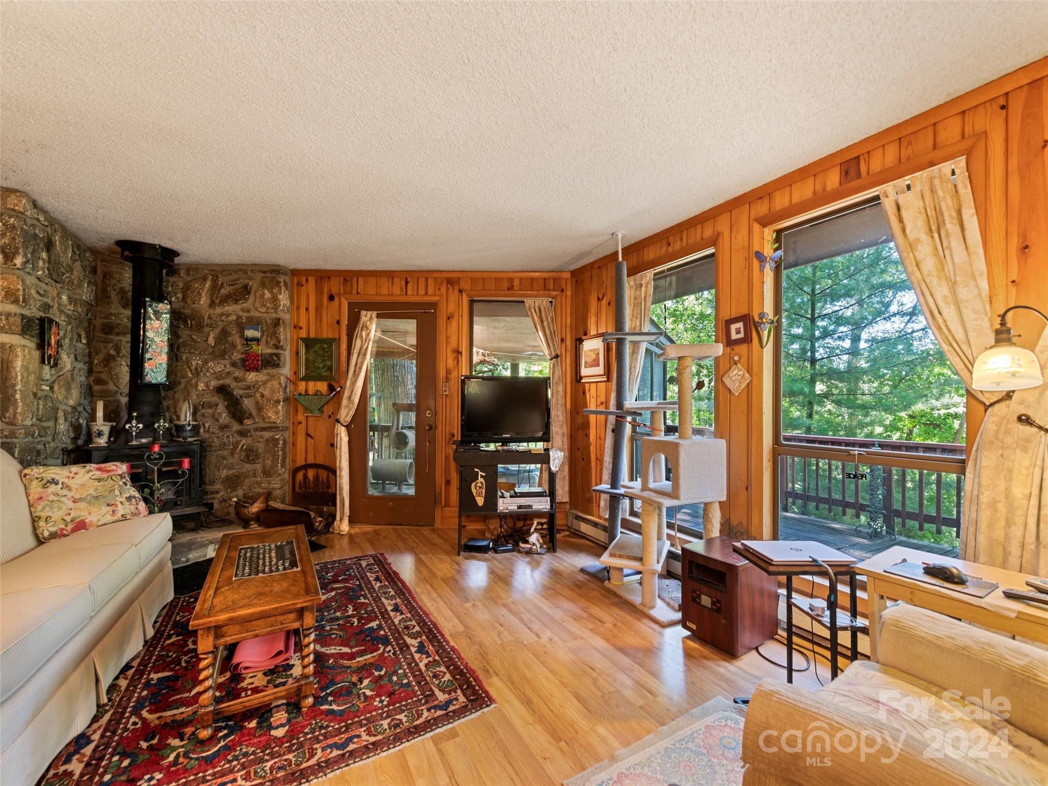 1004 Old Country Road Waynesville, NC 28786 - Photo 14 of 30 a living room with furniture and large windows