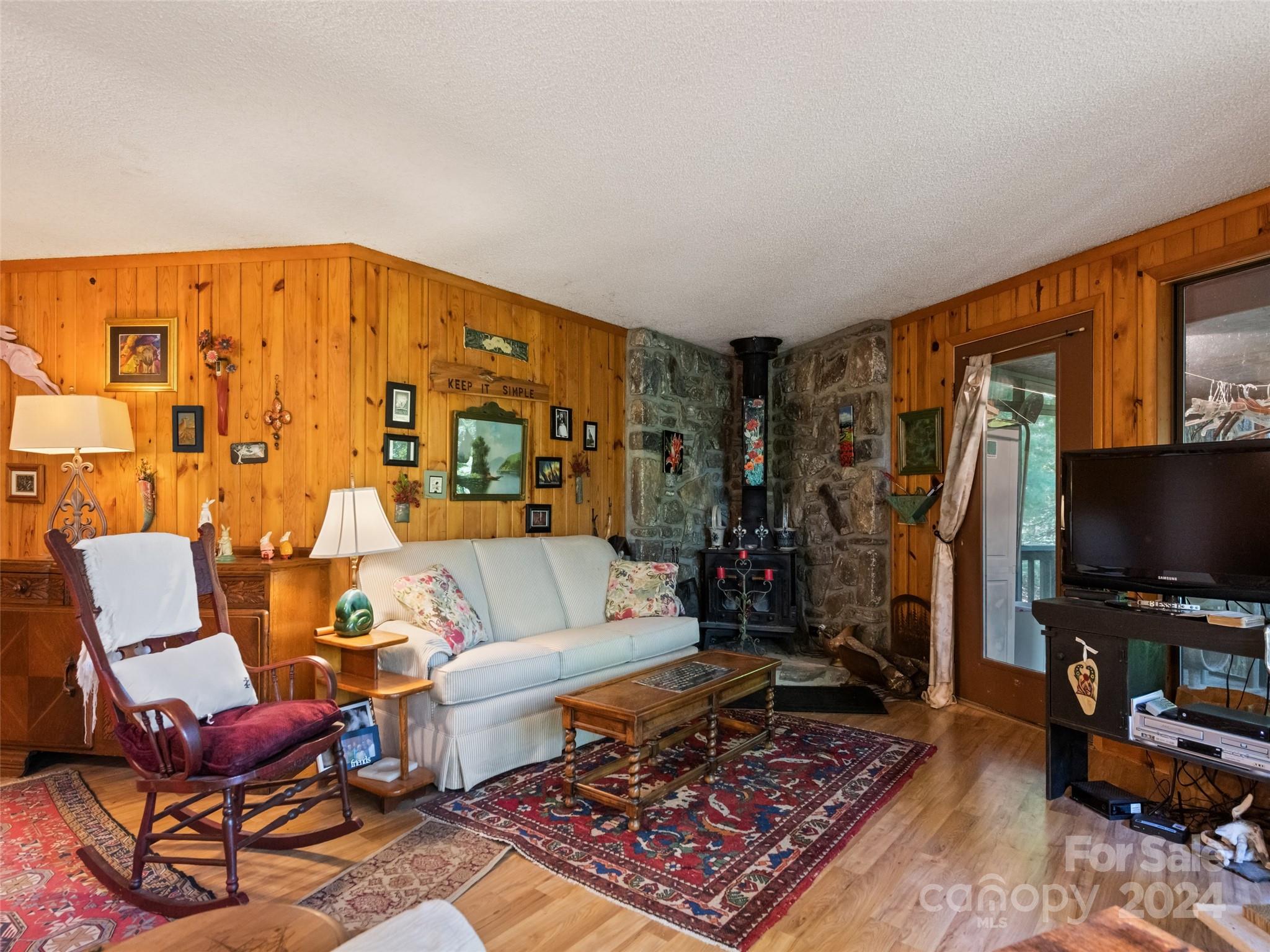 1004 Old Country Road Waynesville, NC 28786 - Photo 15 of 30 a living room with furniture and a flat screen tv