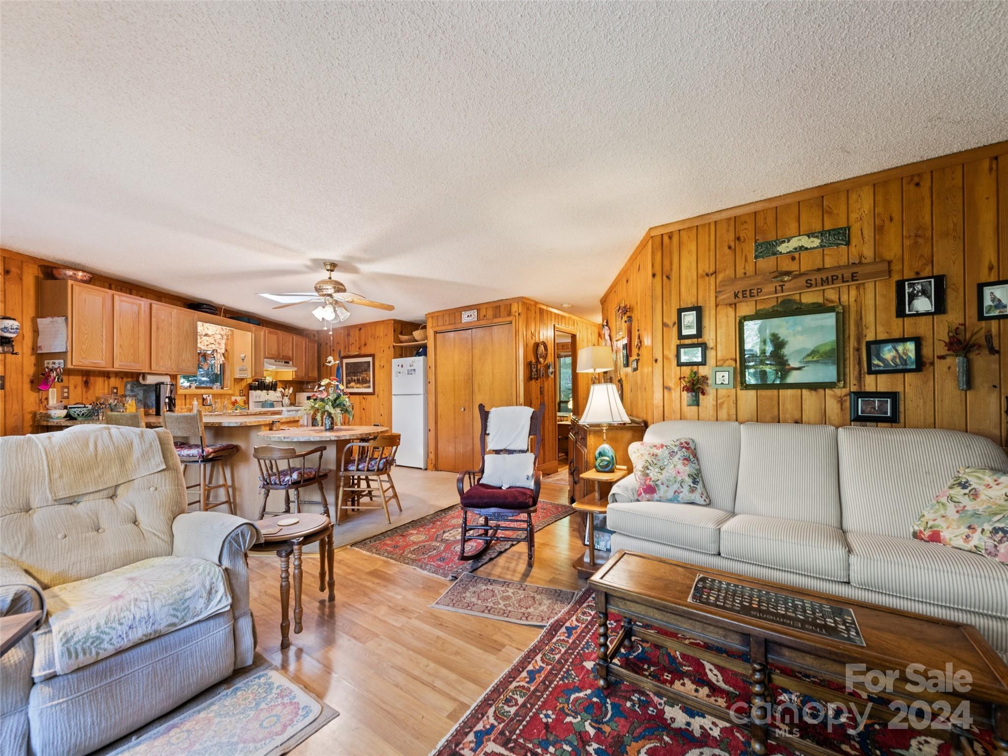 1004 Old Country Road Waynesville, NC 28786 - Photo 16 of 30 a living room with furniture kitchen view and a large window