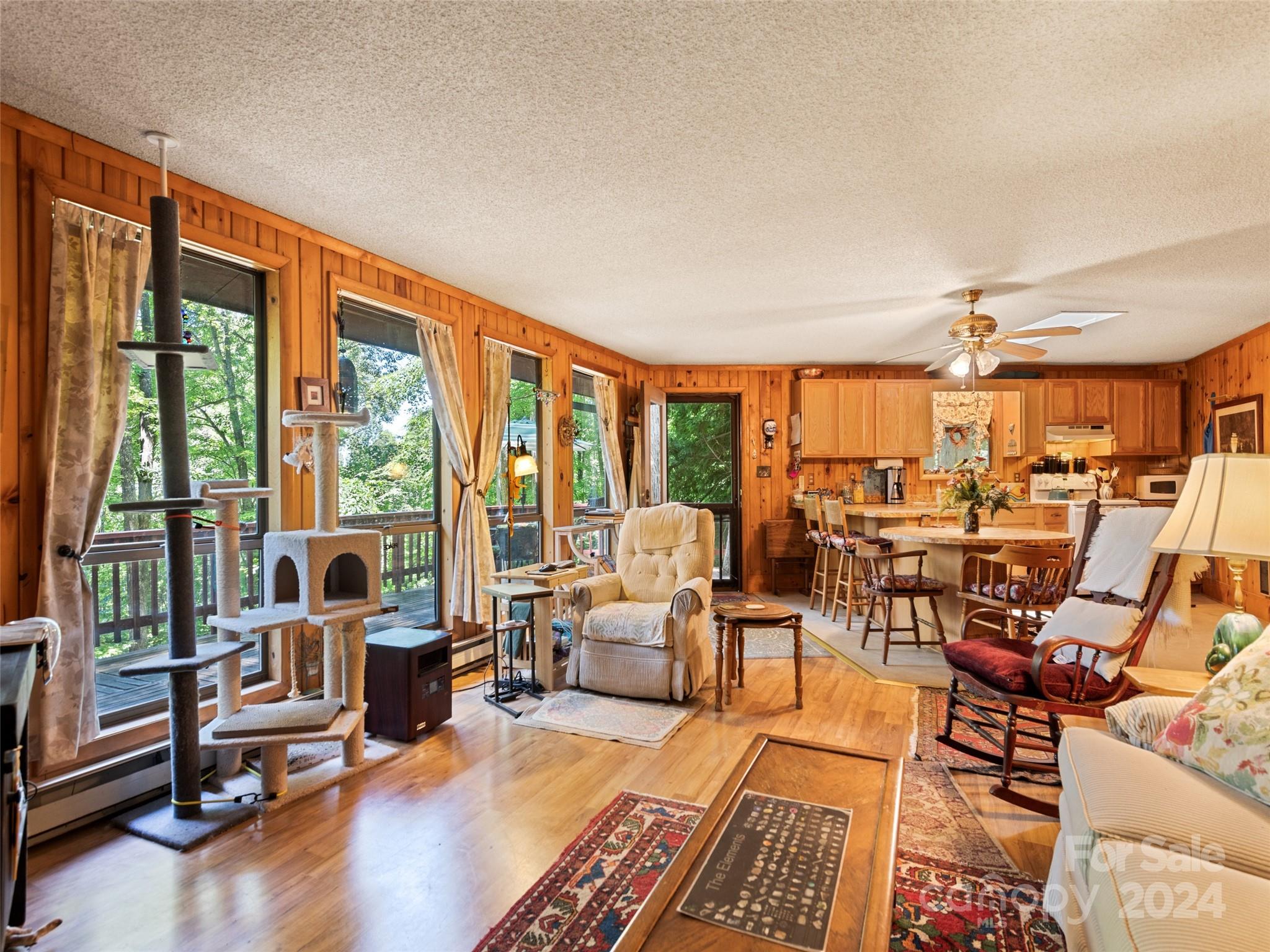 1004 Old Country Road Waynesville, NC 28786 - Photo 17 of 30 a living room with furniture and large windows