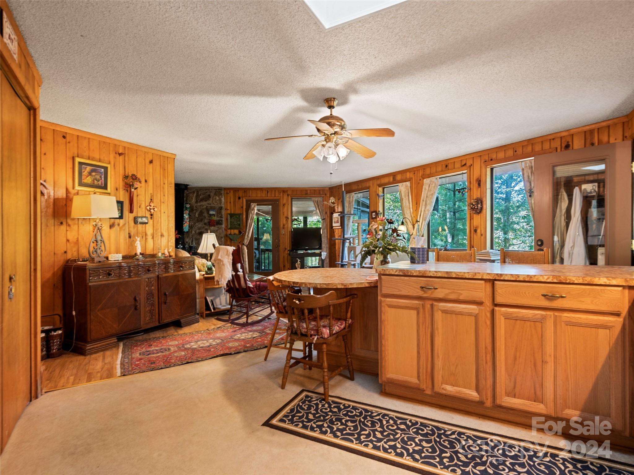 1004 Old Country Road Waynesville, NC 28786 - Photo 21 of 30 a living room with patio furniture and a large window
