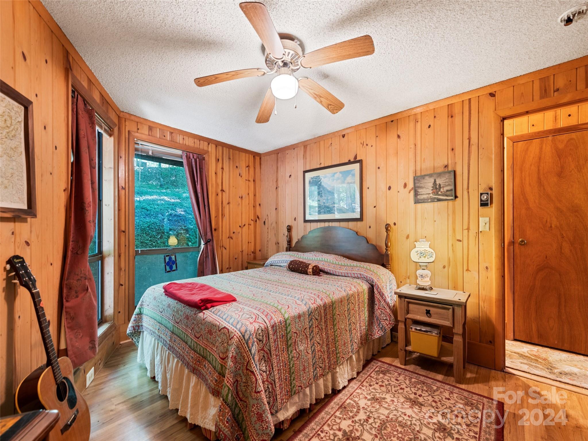 1004 Old Country Road Waynesville, NC 28786 - Photo 23 of 30 a bedroom with a large bed and a window