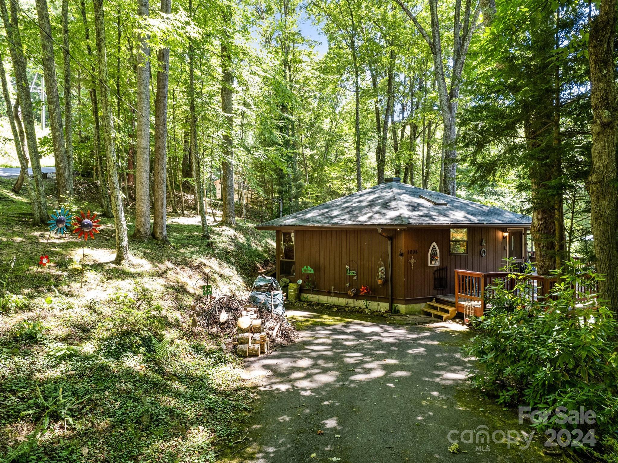 1004 Old Country Road Waynesville, NC 28786 - Photo 5 of 30 a view of a house with a yard and sitting area
