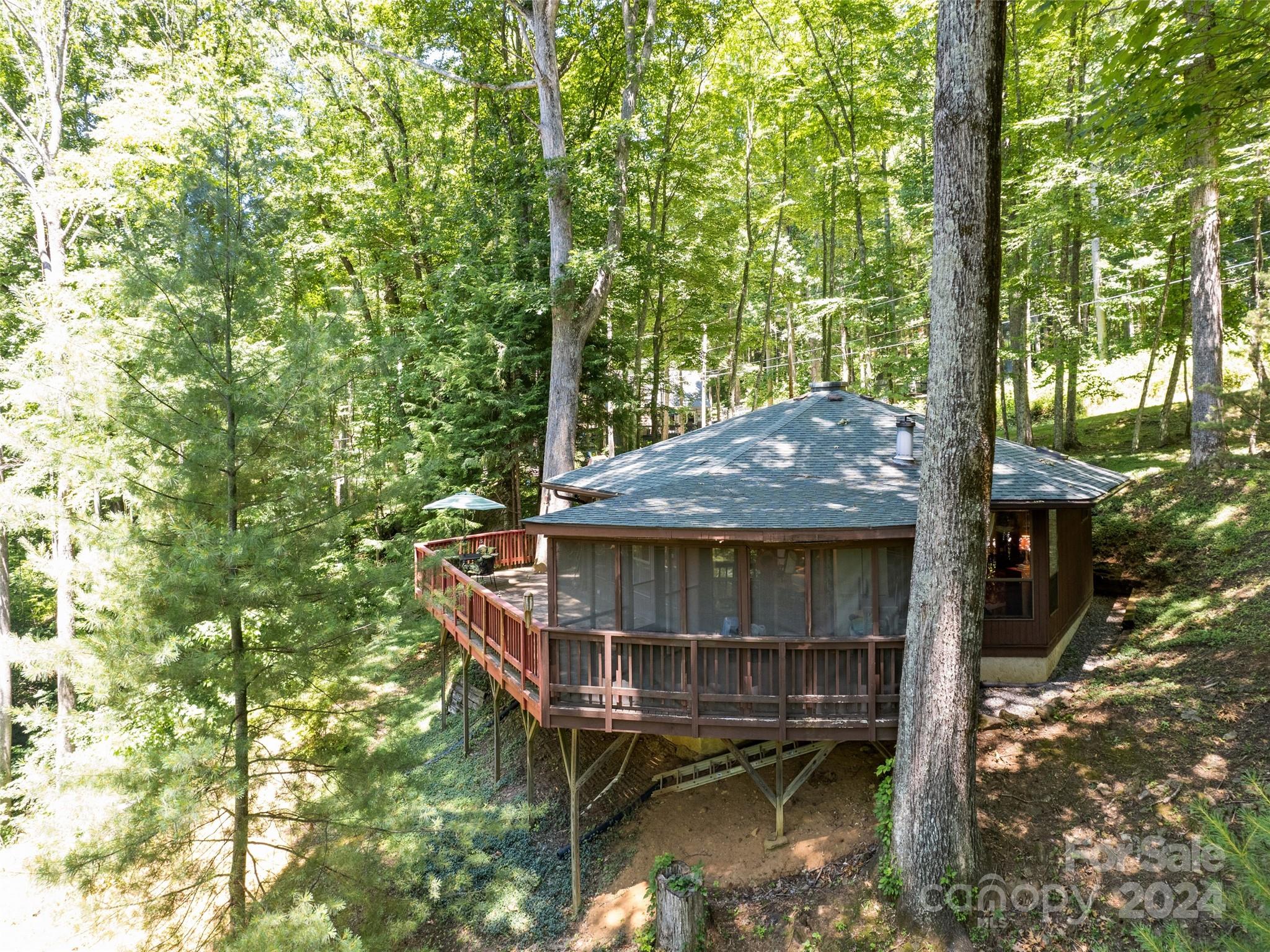 1004 Old Country Road Waynesville, NC 28786 - Photo 6 of 30 a view of house with roof deck and wooden fence