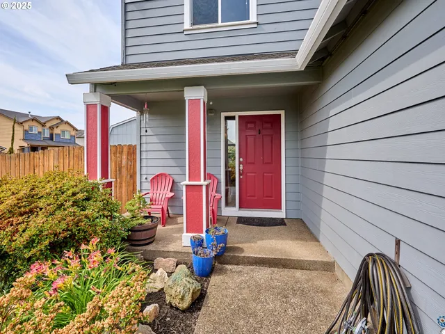 a front view of a house with outdoor seating