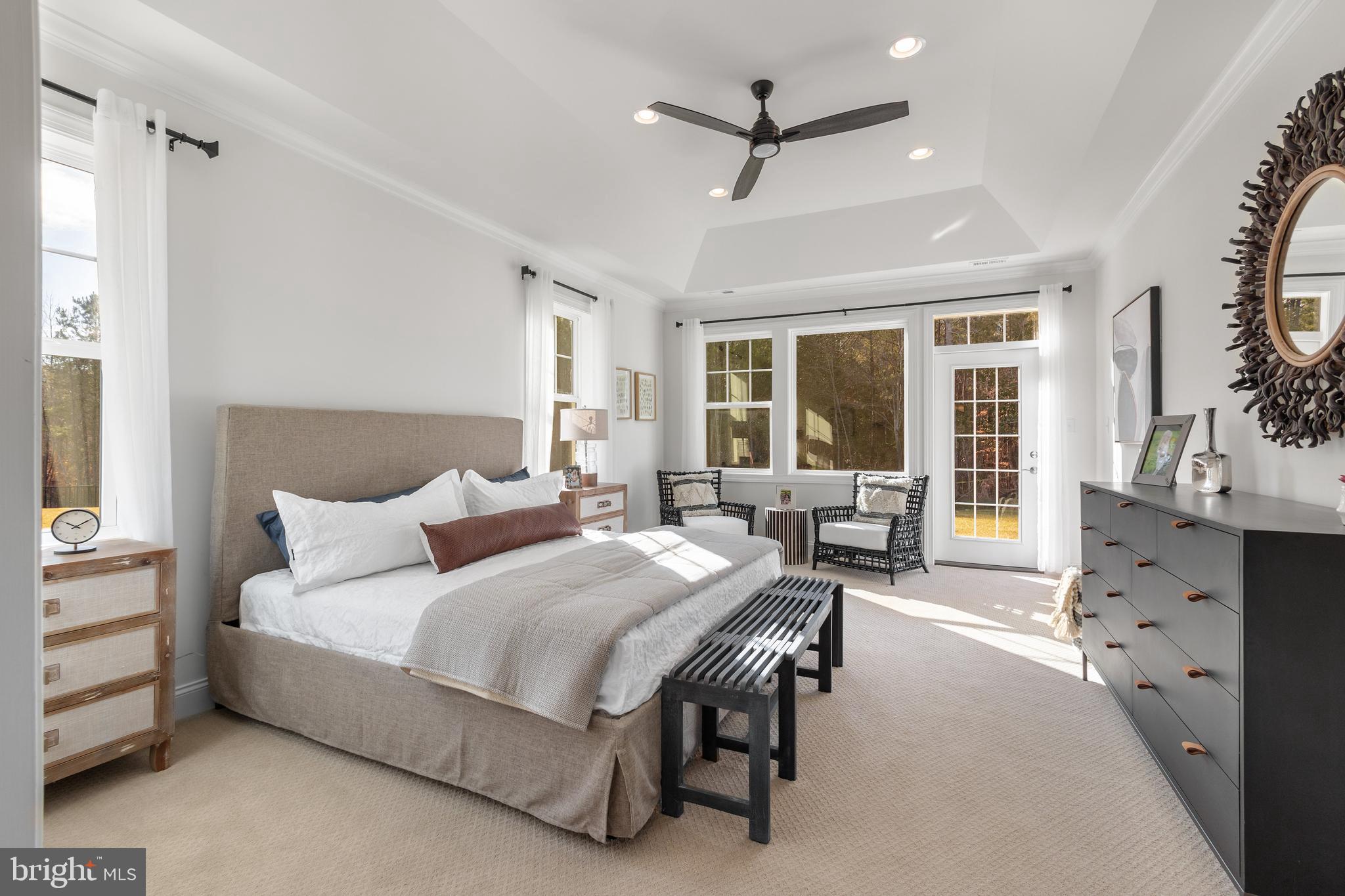 19504 Safflower Way Lewes, DE 19958 - Photo 9 of 19 a bedroom with furniture and a large window
