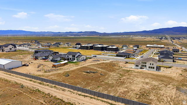 2930 Jojo Road, Unit 110 Eagle Mountain, UT 84005 - Photo 17 of 22 Aerial view of residential area with mountains