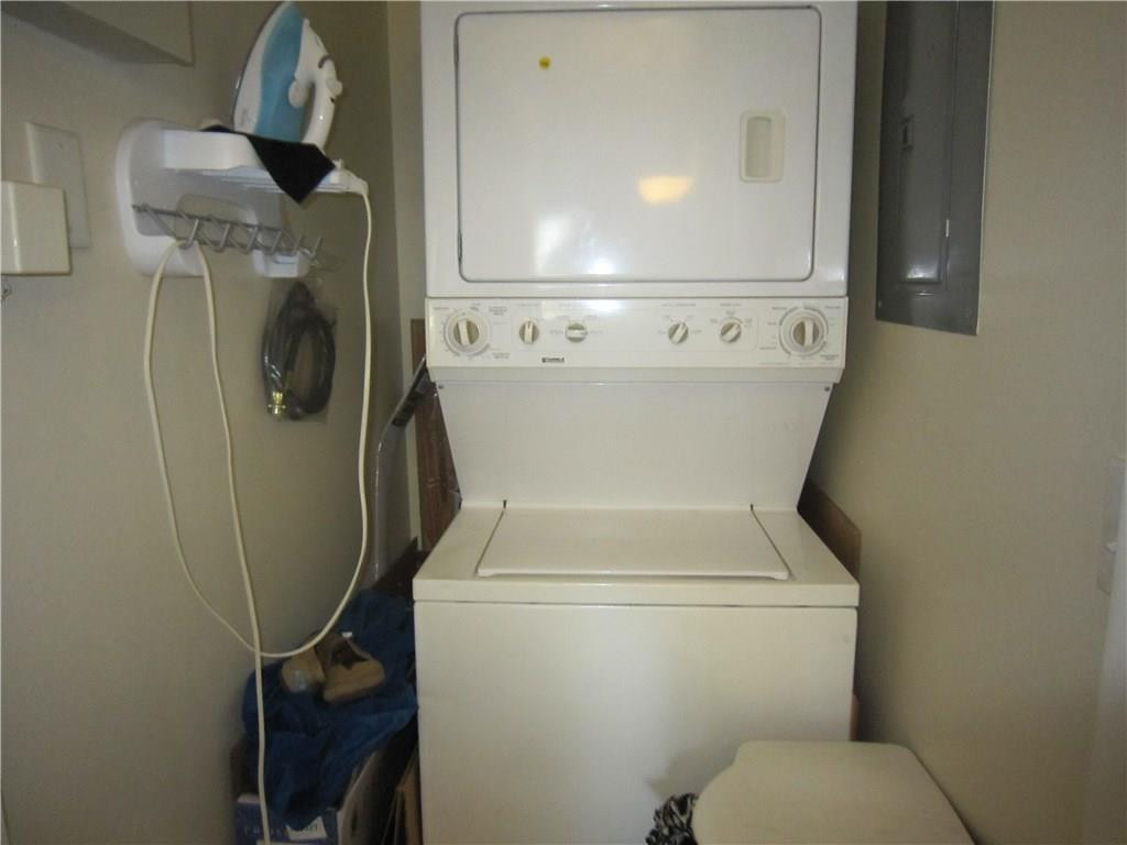3874 Lyons Road, Unit 2036 Coconut Creek, FL 33073 - Photo 15 of 16 a utility room with dryer and washer