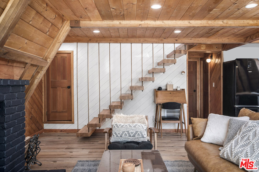 Undisclosed Address Big Bear City, CA 92314 - Photo 17 of 46 a living room with furniture and a fireplace