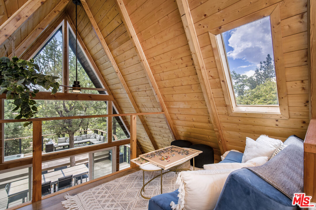 Undisclosed Address Big Bear City, CA 92314 - Photo 19 of 46 a living room with furniture and a window