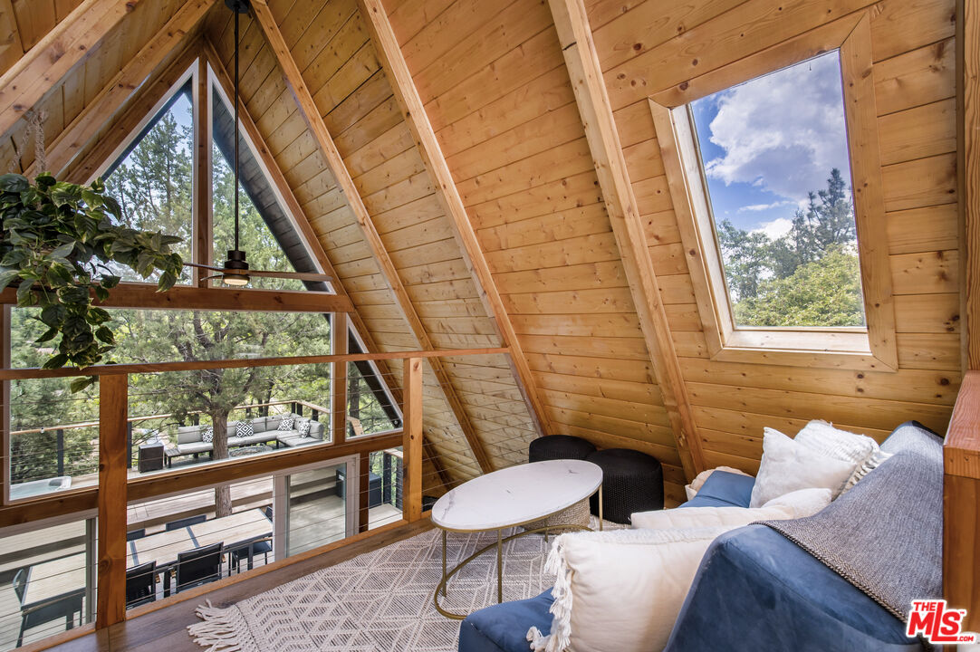 Undisclosed Address Big Bear City, CA 92314 - Photo 20 of 46 a living room with furniture and a window