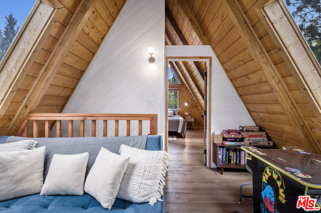 Undisclosed Address Big Bear City, CA 92314 - Photo 21 of 46 a reading room with furniture and wooden floor