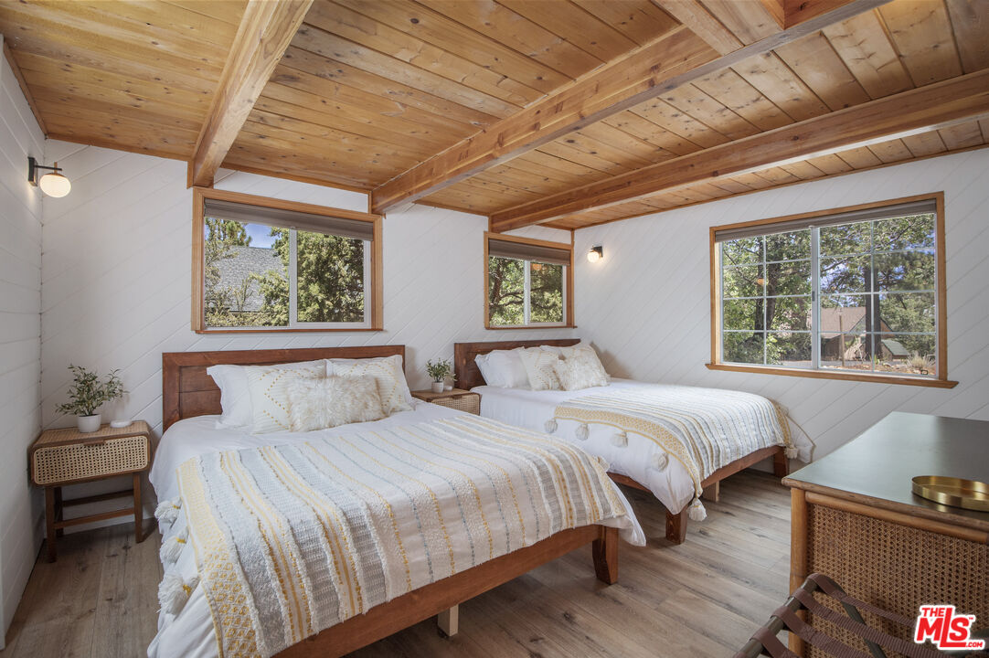 Undisclosed Address Big Bear City, CA 92314 - Photo 26 of 46 a bedroom with double bed and a window