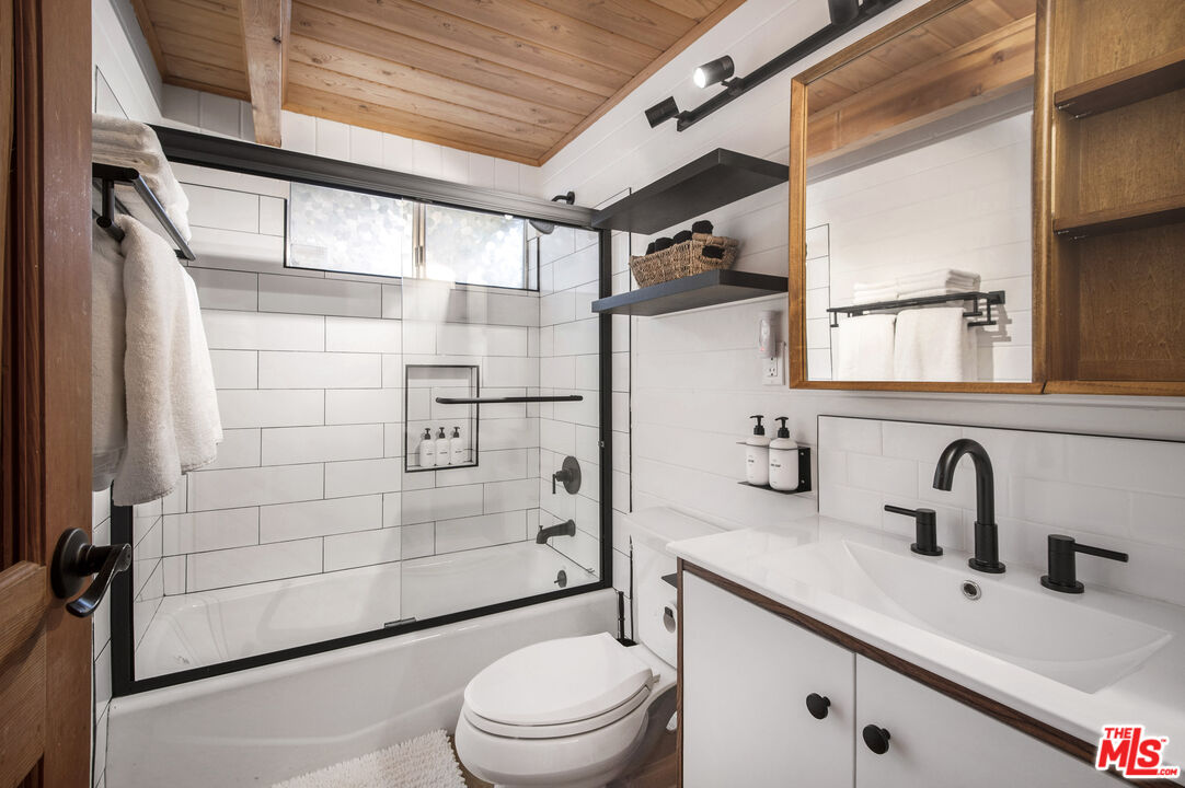 Undisclosed Address Big Bear City, CA 92314 - Photo 29 of 46 a bathroom with a sink toilet and shower