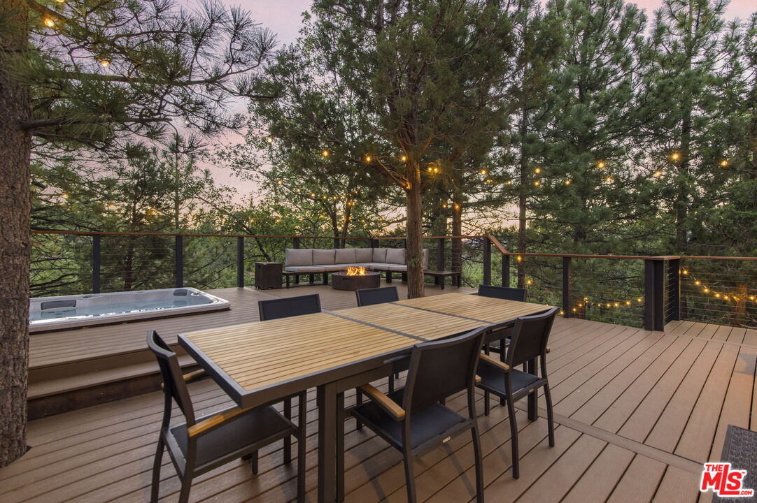 Undisclosed Address Big Bear City, CA 92314 - Photo 32 of 46 a view of a dinning table and chairs in patio of the house