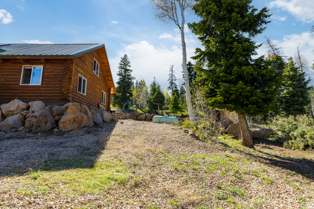 706 Tranquility Drive Springdale, UT 84767 - Photo 32 of 55 North Elevation: Side view of the cabin highlighting the well-maintained exterior.