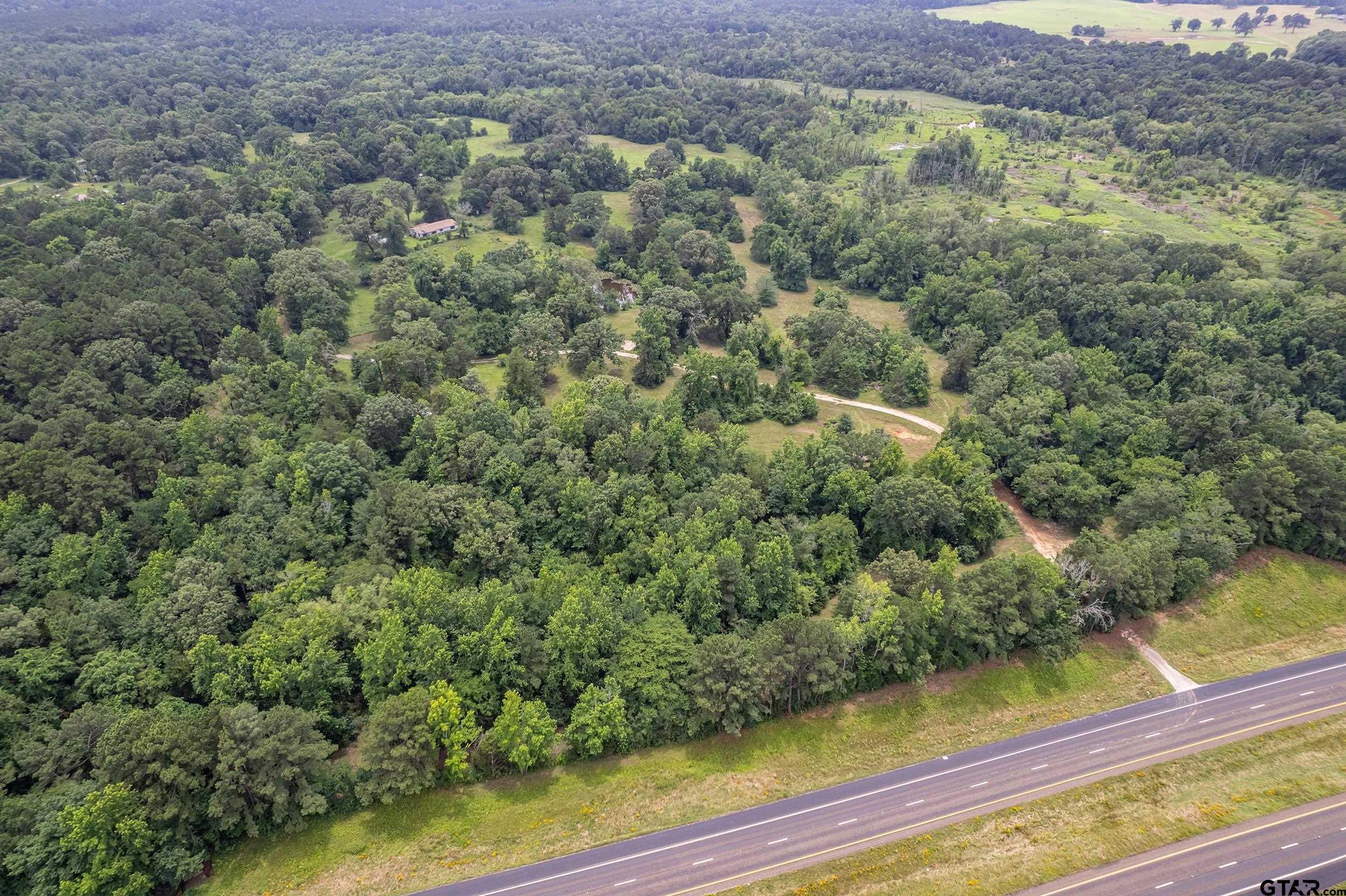 271 Tyler Tx 75708 Tyler, TX 75708 - Photo 22 of 44 a view of a forest with a houses