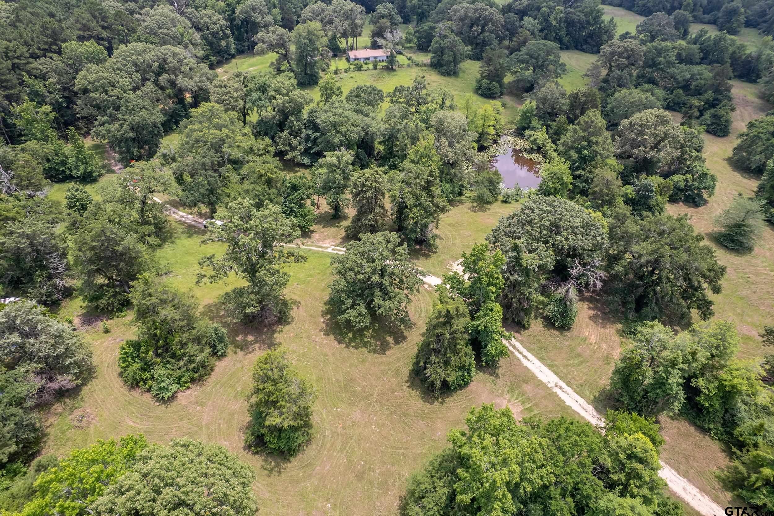271 Tyler Tx 75708 Tyler, TX 75708 - Photo 3 of 44 an aerial view of residential house with yard and outdoor seating