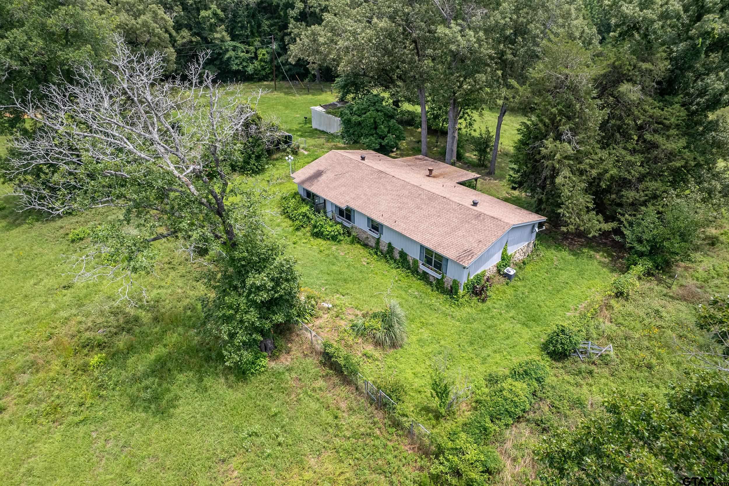 271 Tyler Tx 75708 Tyler, TX 75708 - Photo 39 of 44 an aerial view of a house with swimming pool and garden