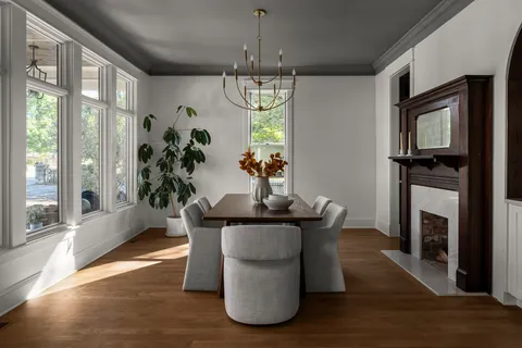 a kitchen with a sink a stove and cabinets