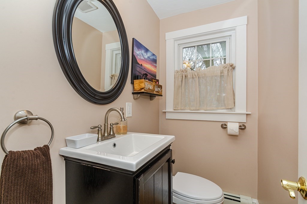39 Chittick Road Boston, MA 02136 - Photo 11 of 24 a bathroom with a sink vanity mirror and toilet