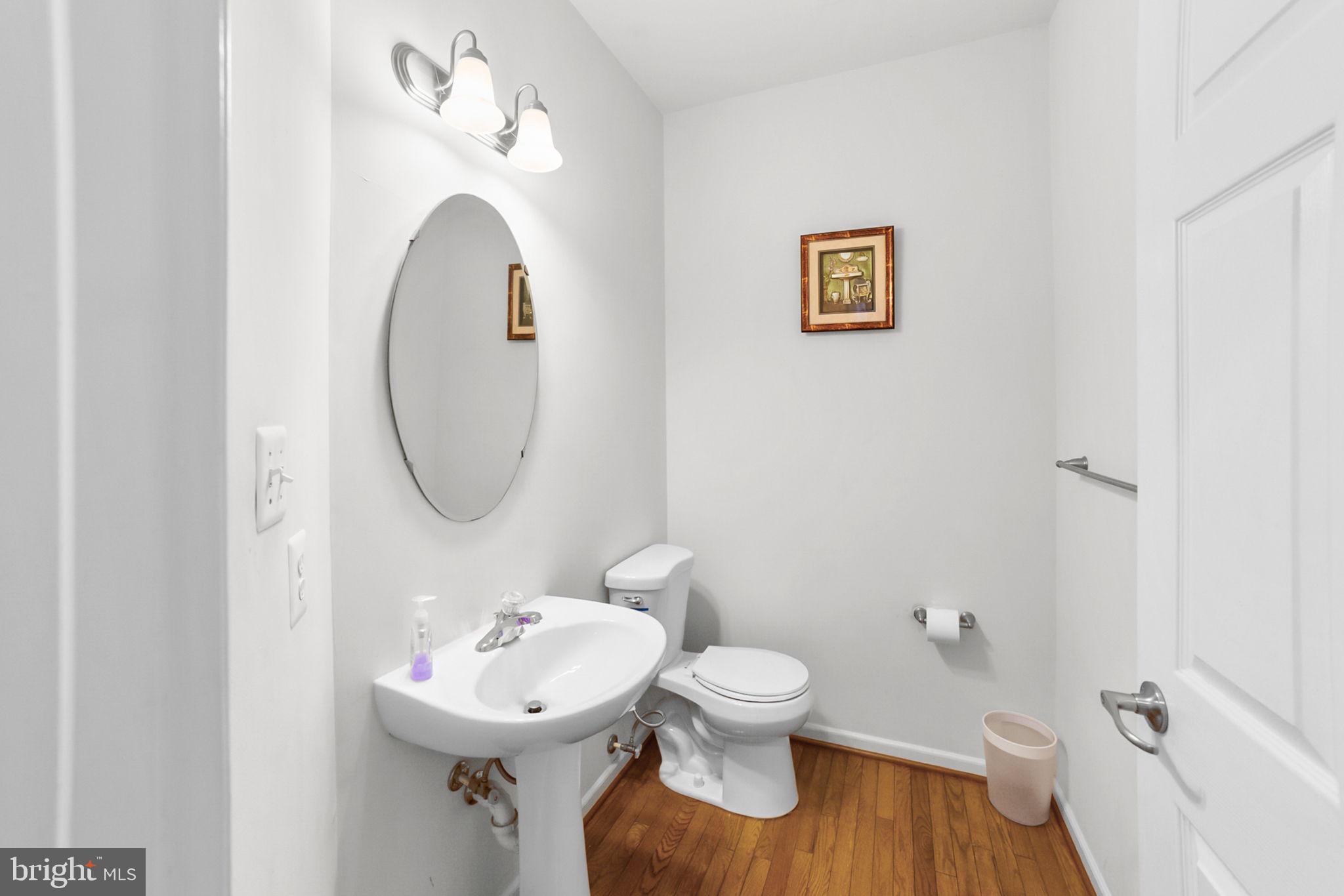 14909 Taryn Lea Court Accokeek, MD 20607 - Photo 12 of 49 a bathroom with a sink mirror and toilet