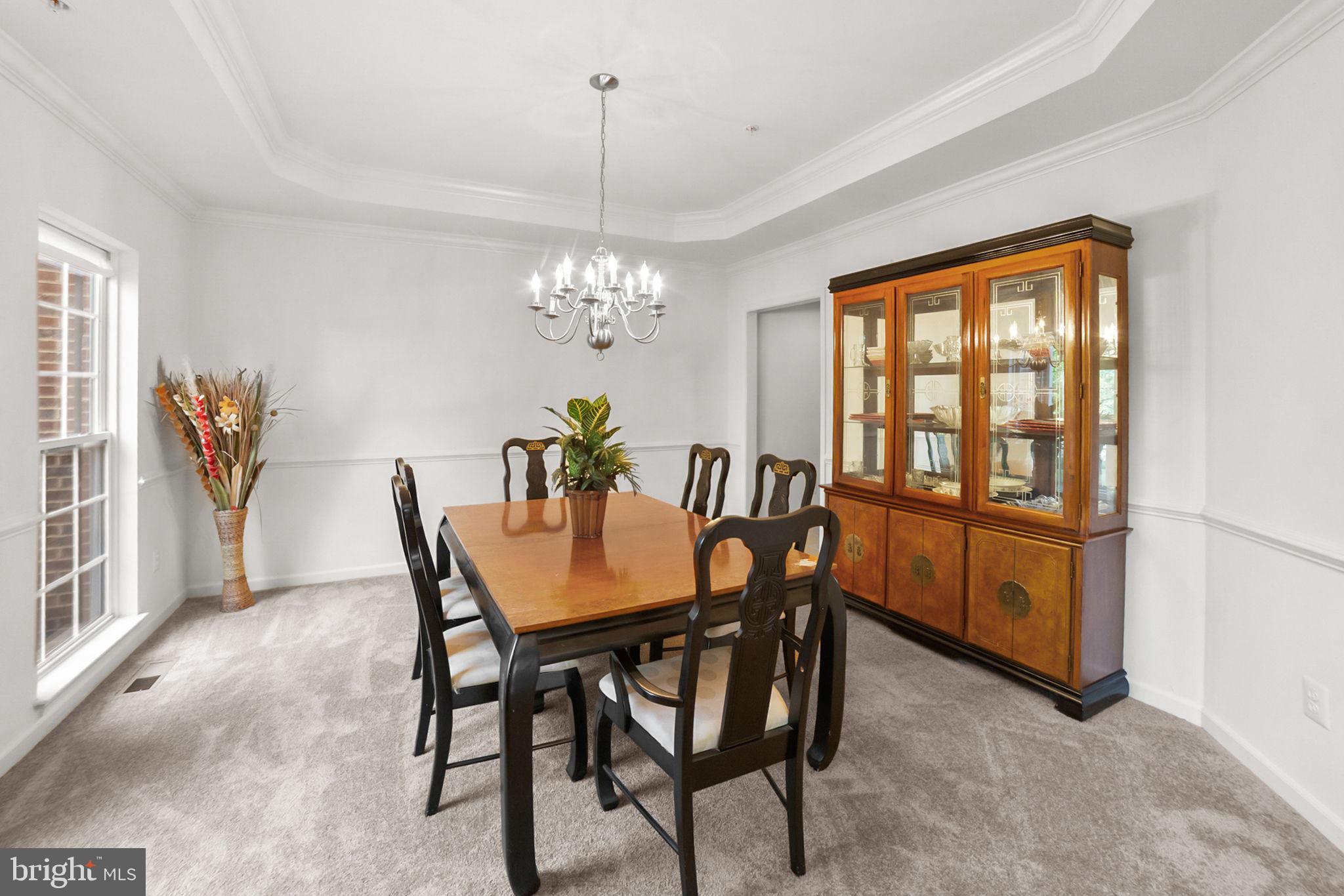 14909 Taryn Lea Court Accokeek, MD 20607 - Photo 16 of 49 a dining room with furniture a chandelier and window