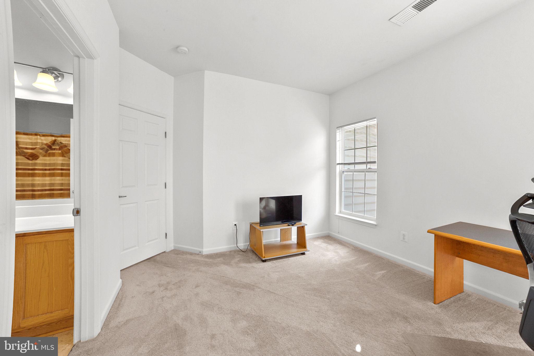 14909 Taryn Lea Court Accokeek, MD 20607 - Photo 26 of 49 a living room with furniture and a window