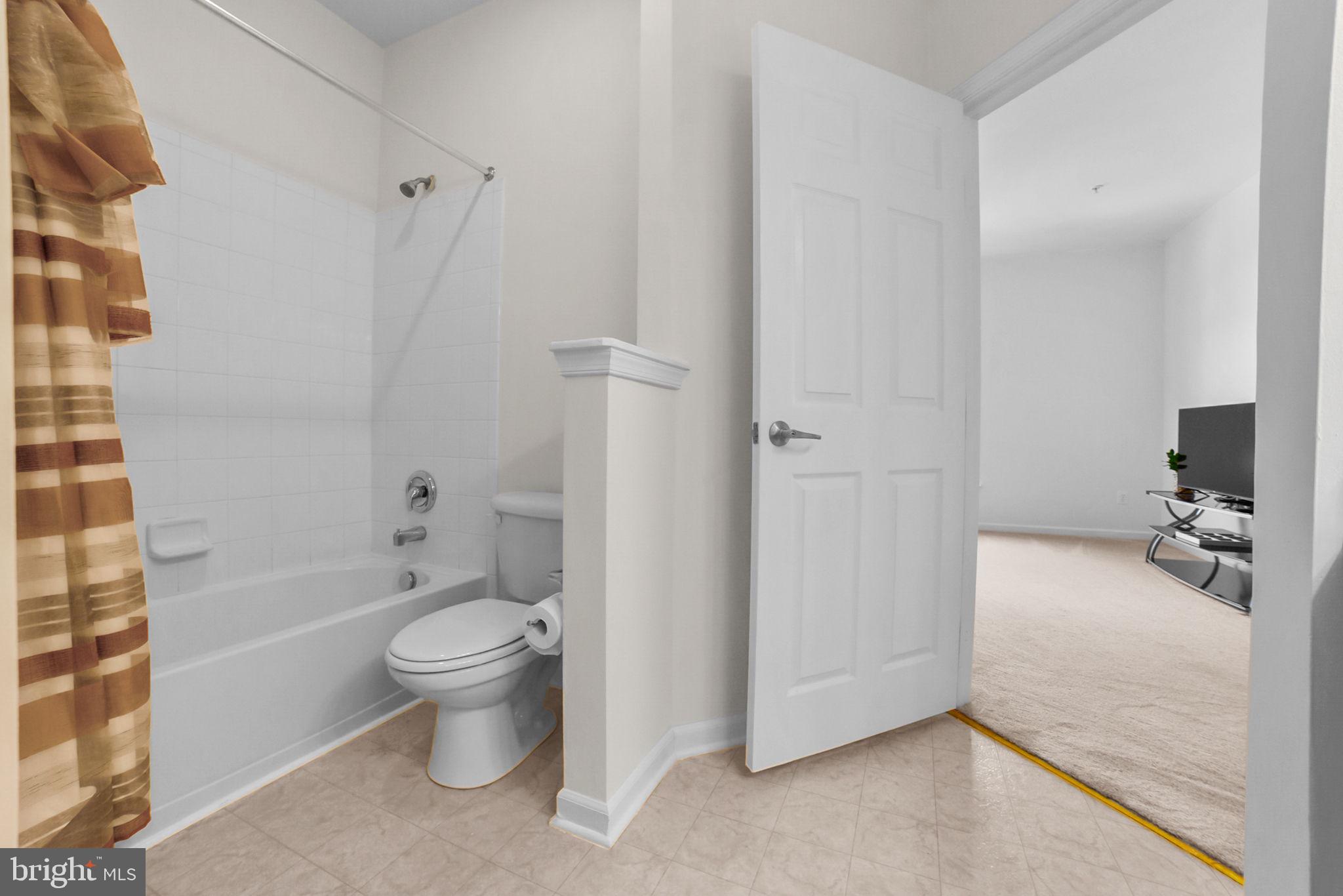 14909 Taryn Lea Court Accokeek, MD 20607 - Photo 28 of 49 a bathroom with a toilet sink and a bathtub
