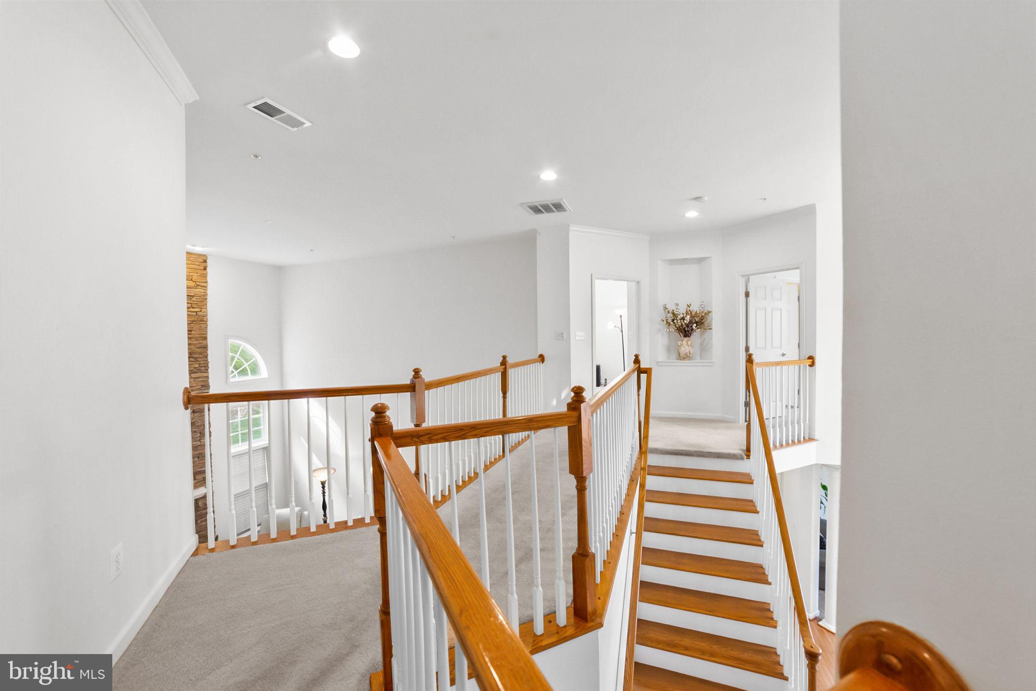 14909 Taryn Lea Court Accokeek, MD 20607 - Photo 32 of 49 a view of entryway with wooden floor and stairs