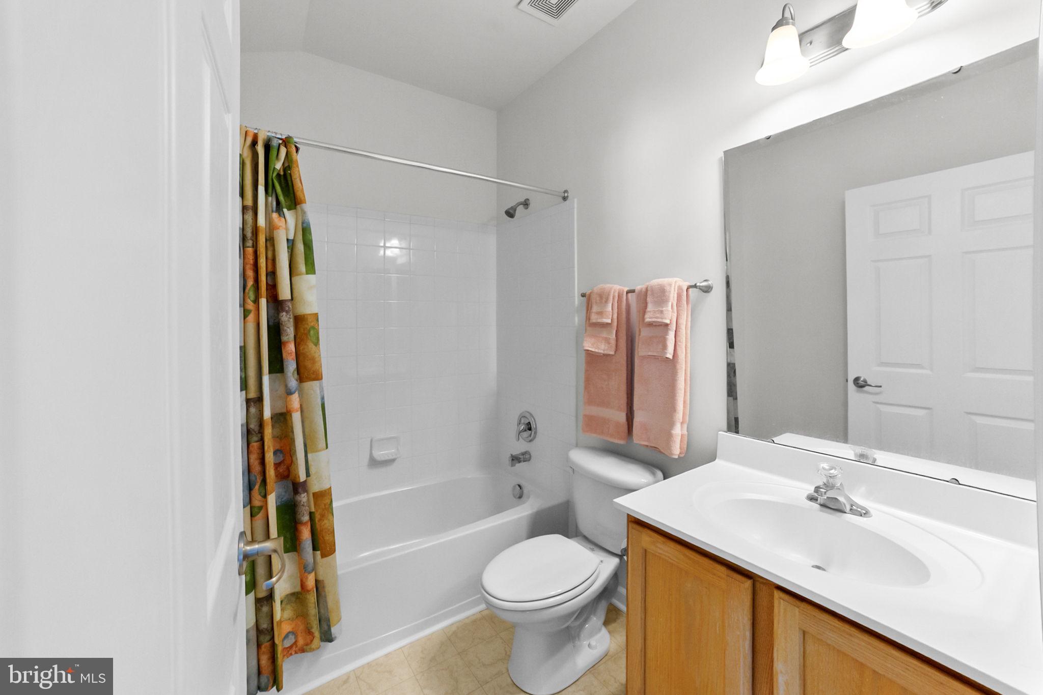 14909 Taryn Lea Court Accokeek, MD 20607 - Photo 36 of 49 a bathroom with a sink toilet and shower