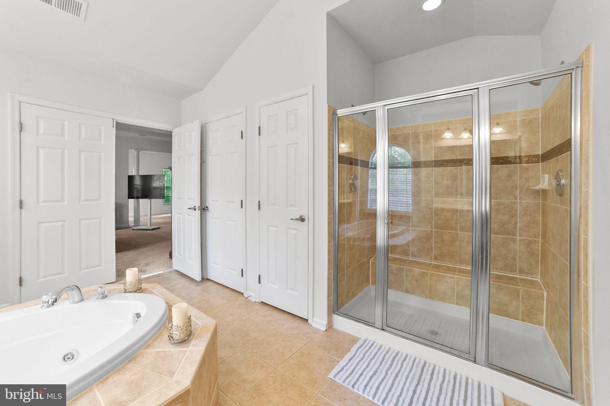 14909 Taryn Lea Court Accokeek, MD 20607 - Photo 42 of 49 a bathroom with a tub shower and sink