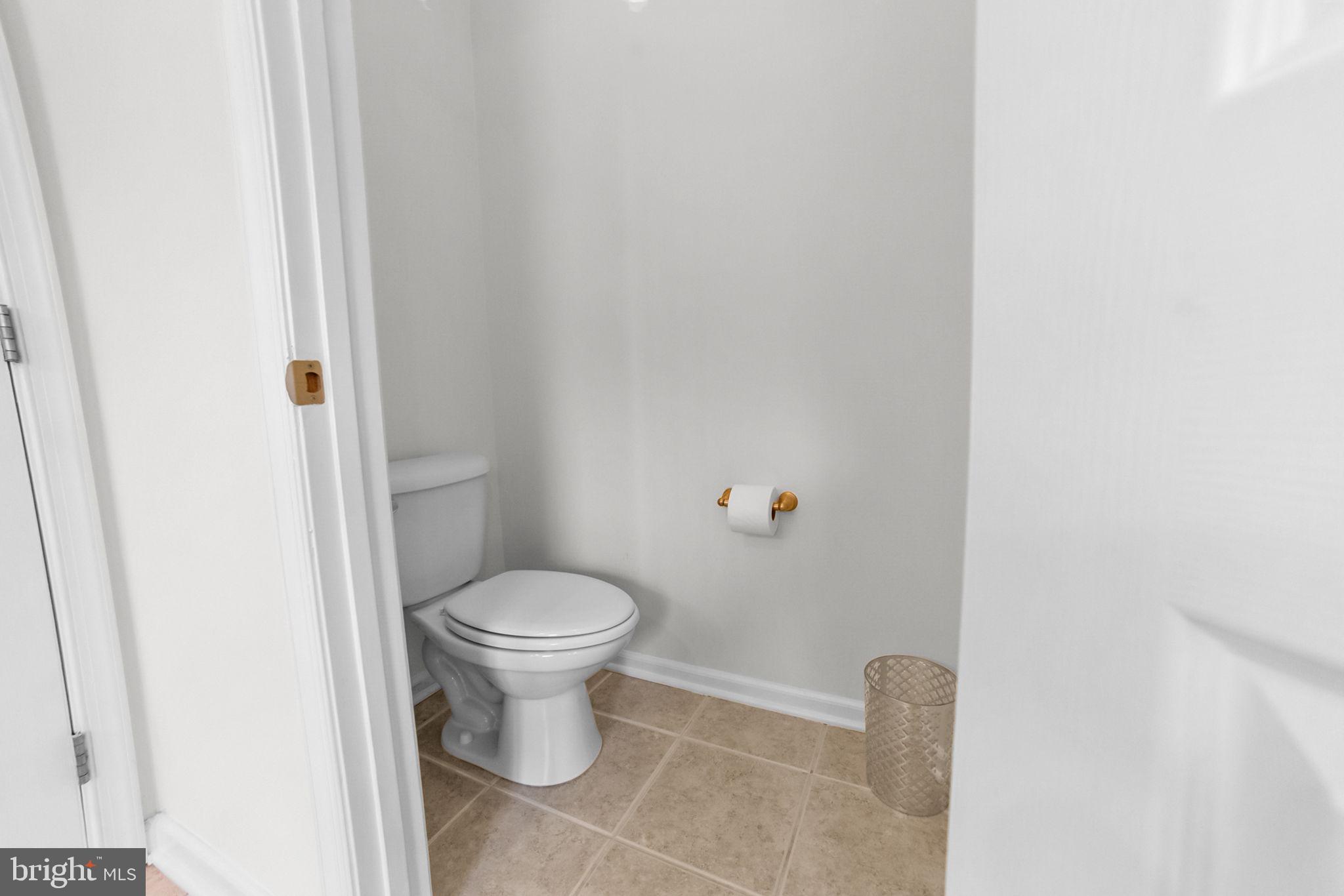 14909 Taryn Lea Court Accokeek, MD 20607 - Photo 43 of 49 a white toilet sitting next to a white cabinet