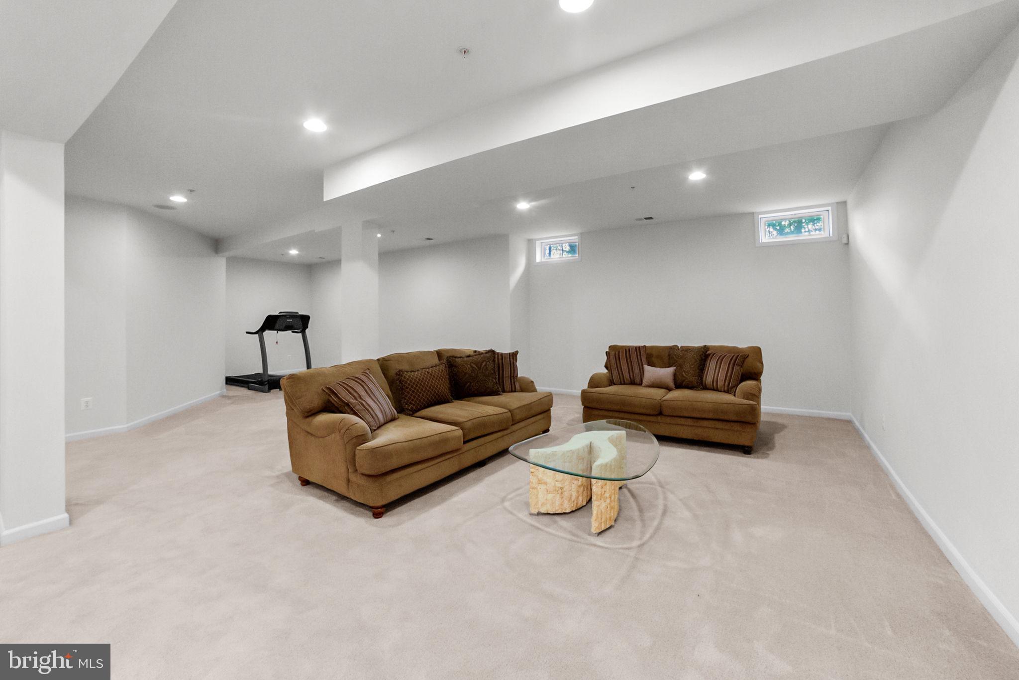 14909 Taryn Lea Court Accokeek, MD 20607 - Photo 45 of 49 a living room with furniture and a couch