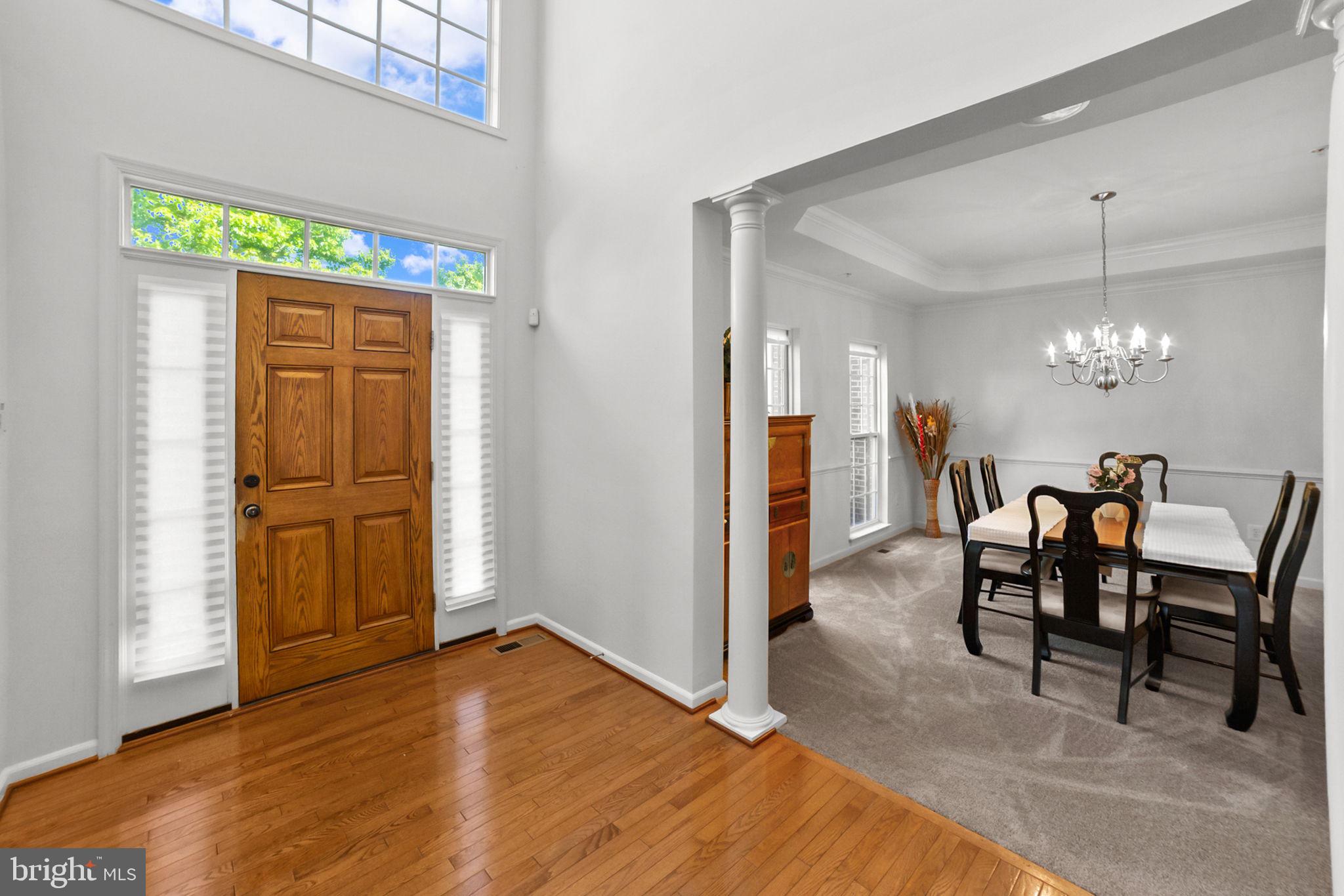14909 Taryn Lea Court Accokeek, MD 20607 - Photo 7 of 49 a view of a dining room with furniture and chandelier